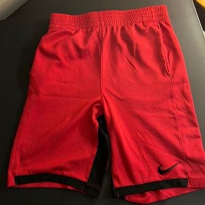 YXL Boys Nike dri fit shorts. Red with black trim